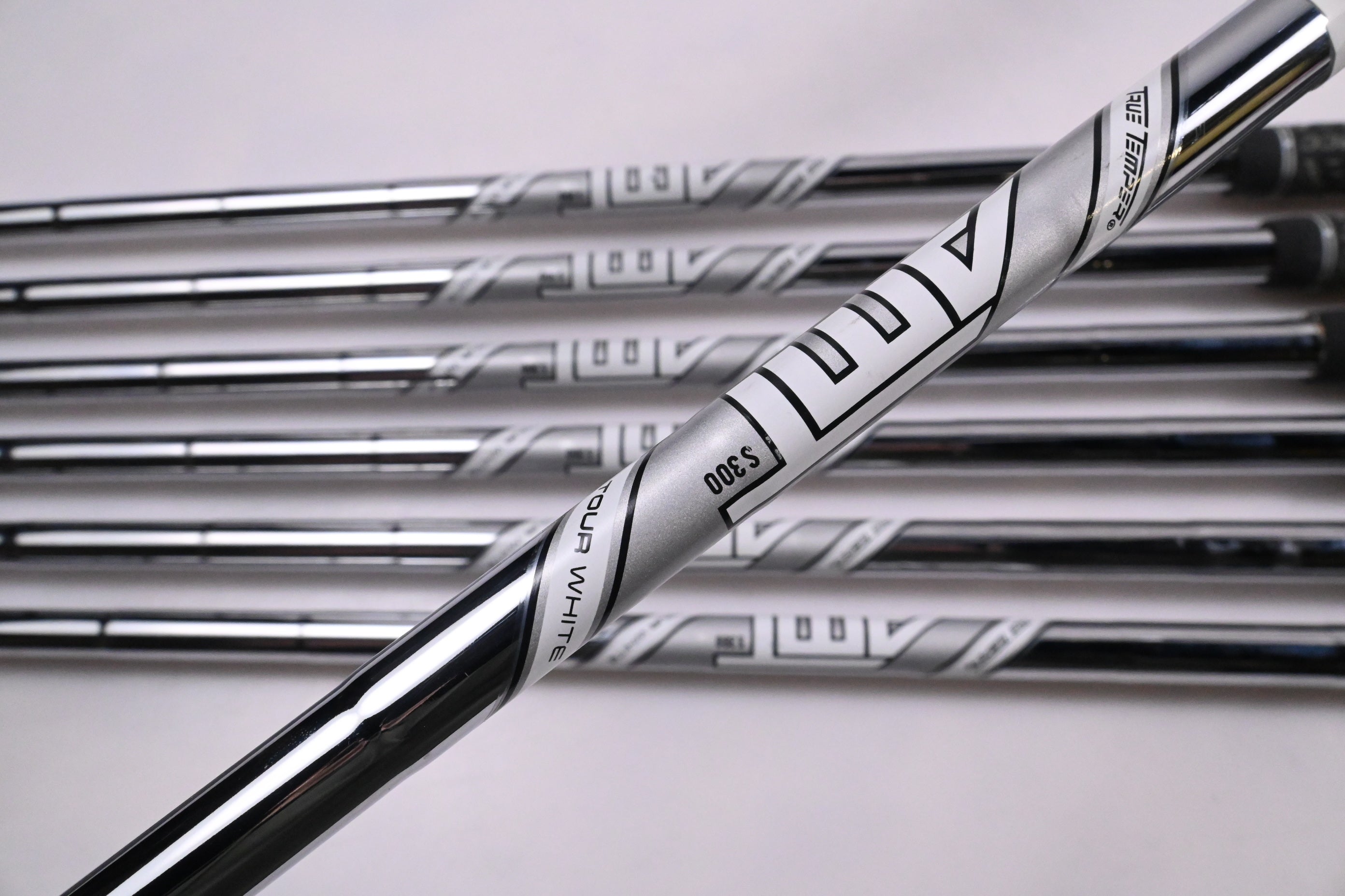 Left Hand Titleist T100 2021 Irons / 5-PW+48° / Stiff Flex AMT Tour White S300
