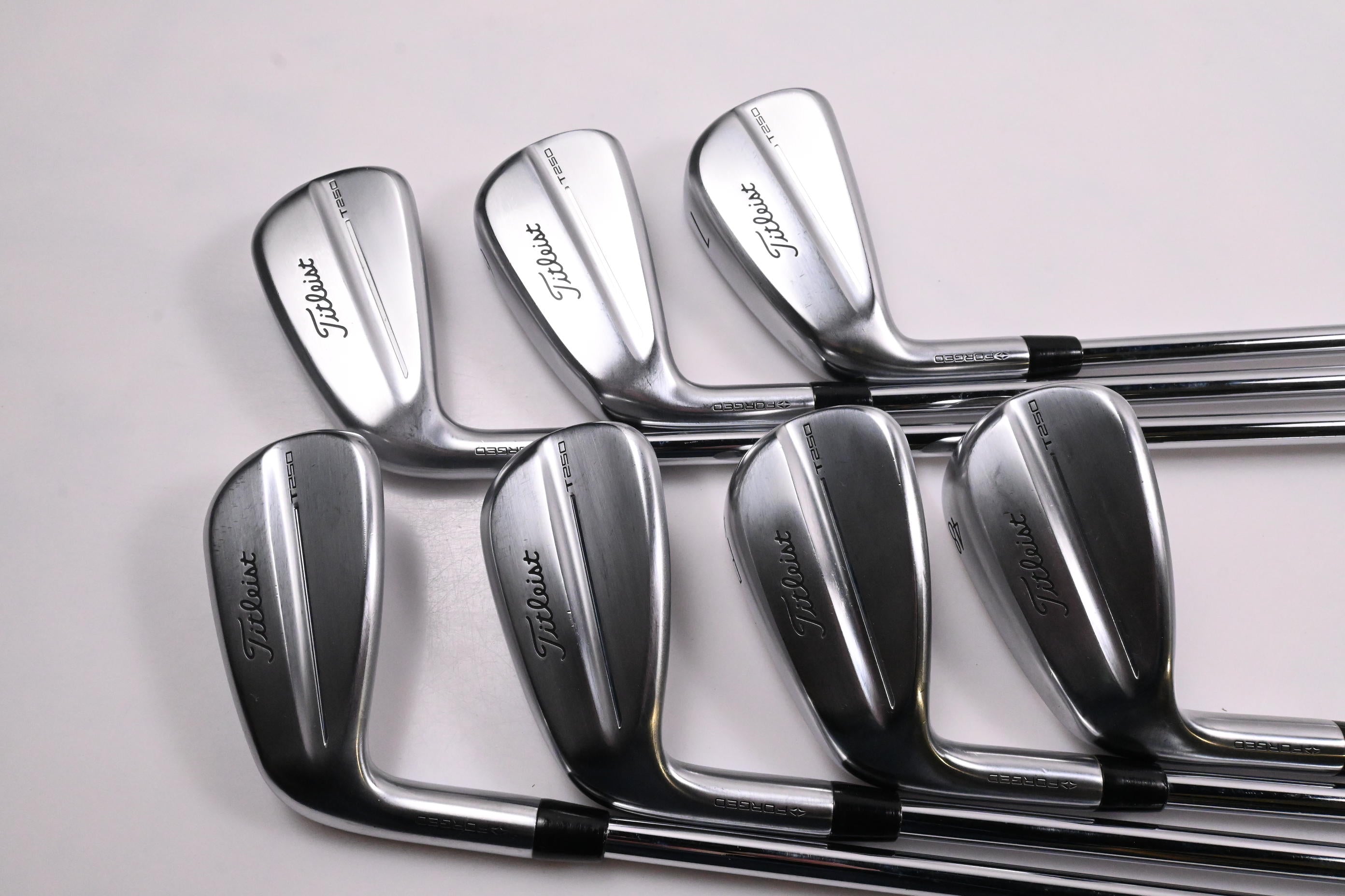 Left Hand Titleist T250 2025 Irons / 5-PW+48° / Regular Flex AMT Black Shafts
