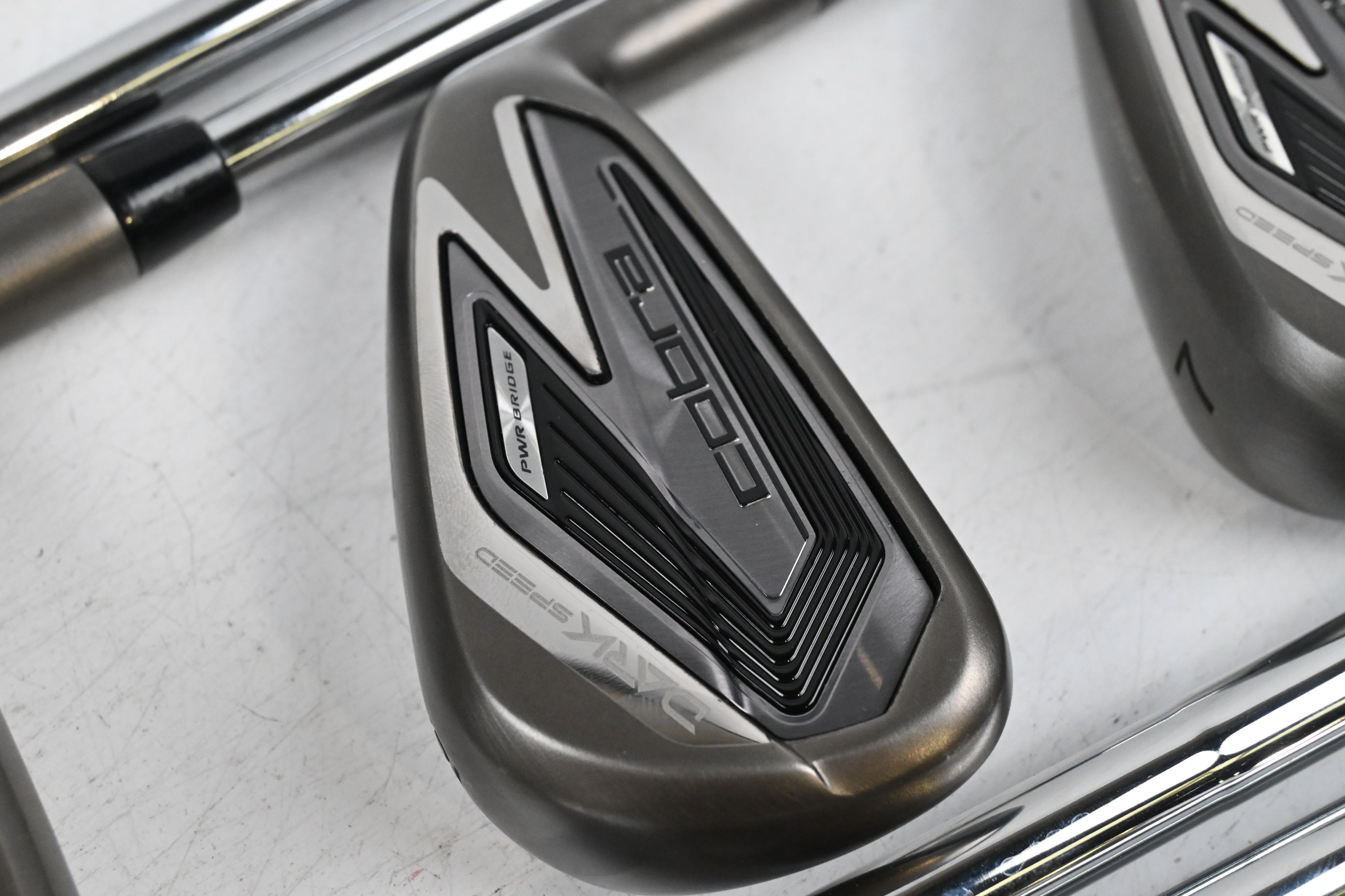 Cobra Darkspeed Irons / 4-PW+GW+SW / Stiff Flex Dynamic Gold 105 S300 Shafts